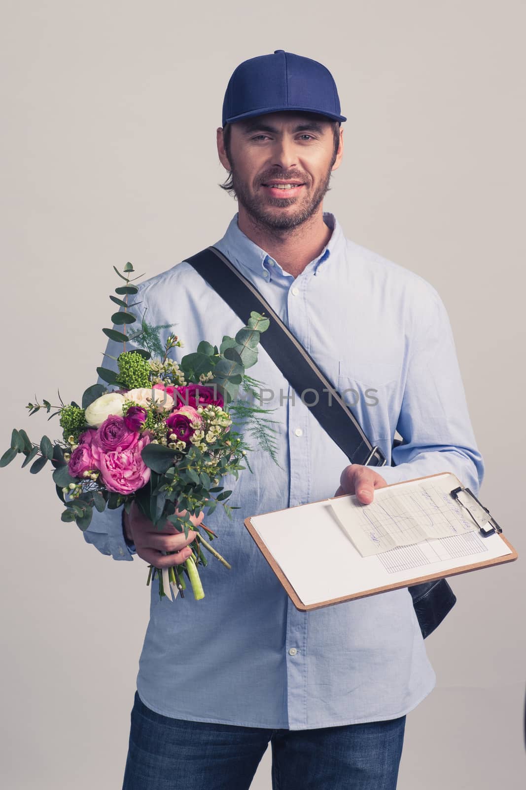 Delivery man bringing flower bouquet by ALotOfPeople
