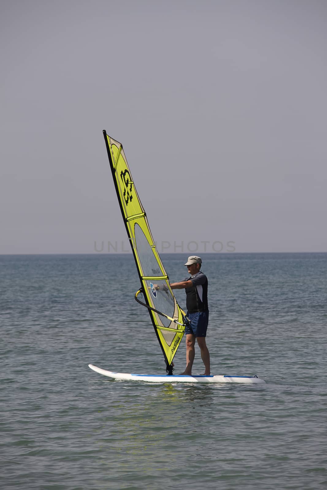 Windsurfing in the blue sea of Sardinia