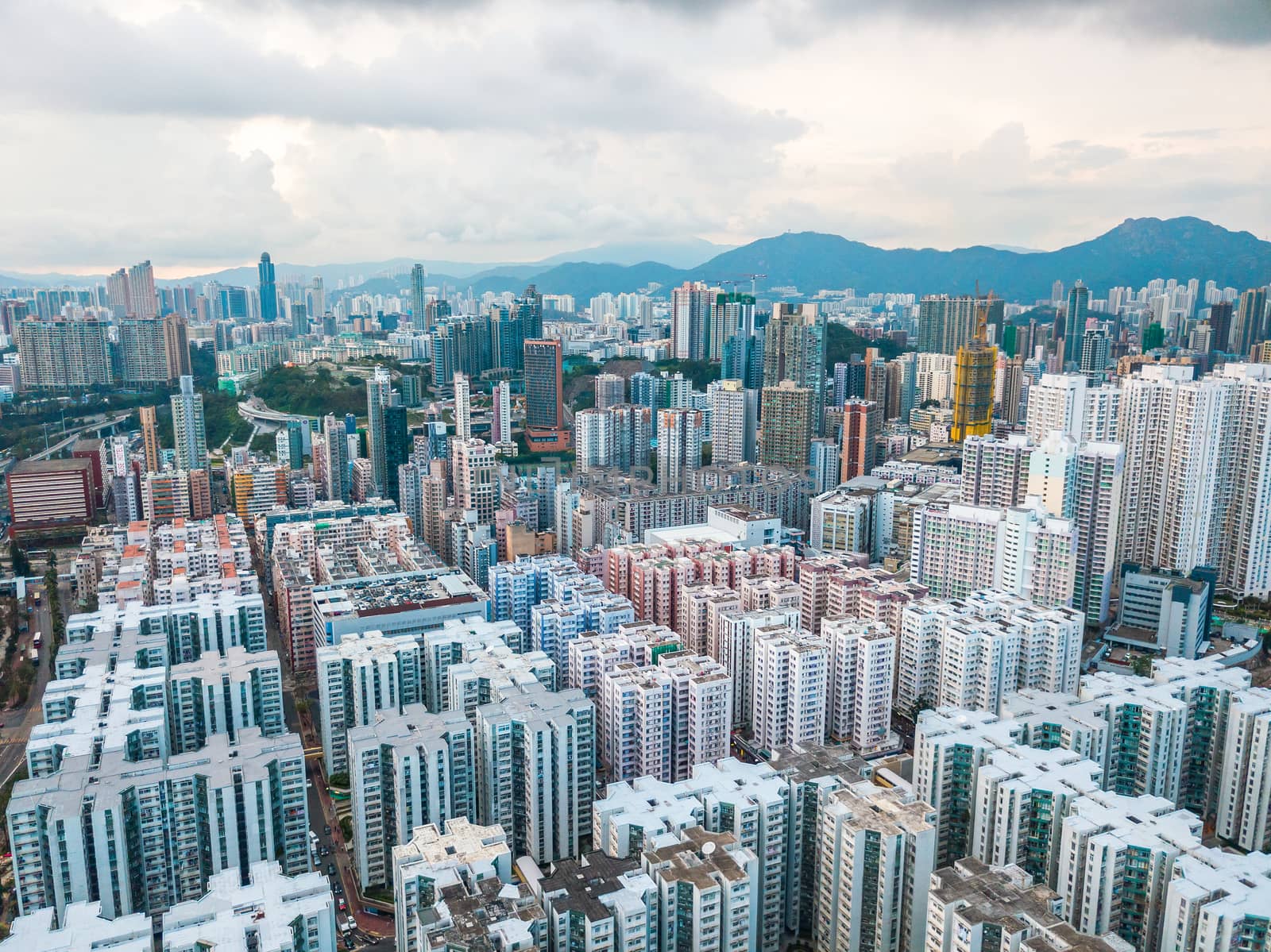 Top view aerial photo from flying drone of a HongKong Global City with development buildings, transportation, energy power infrastructure. Financial and business centers in developed China town