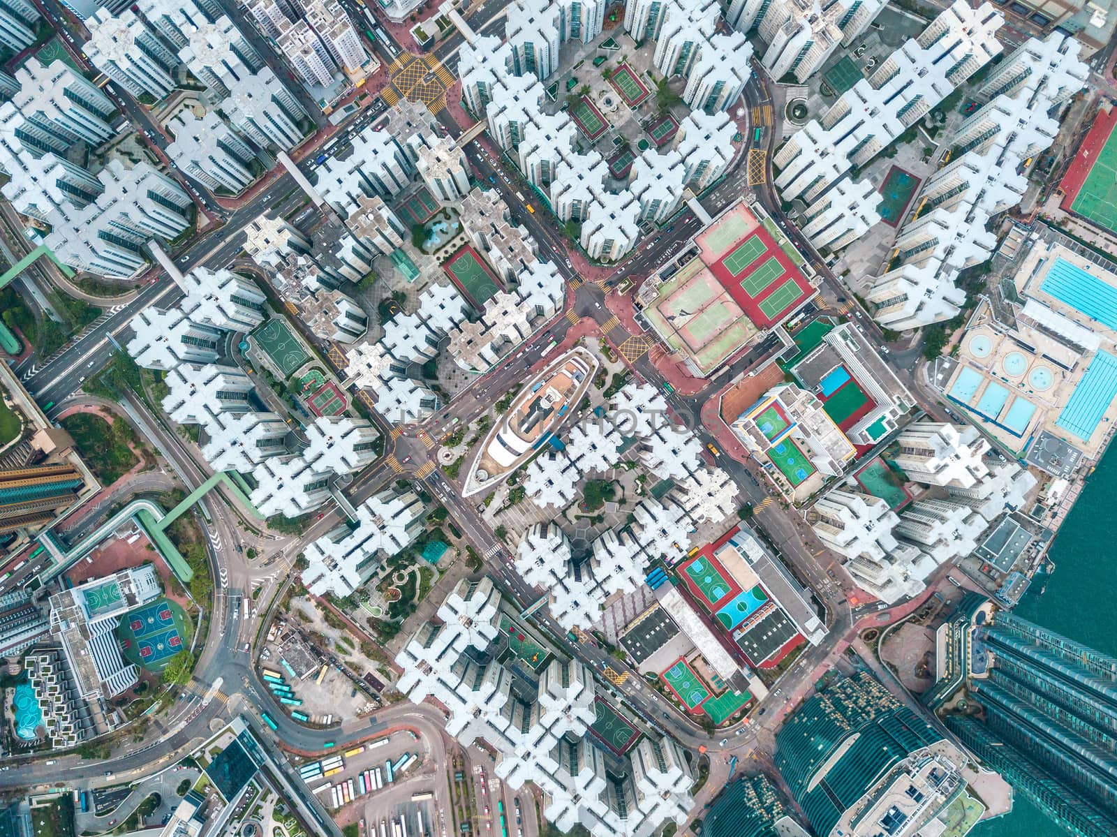 Top view aerial photo from flying drone of a HongKong Global City with development buildings, transportation, energy power infrastructure. Financial and business centers in developed China town