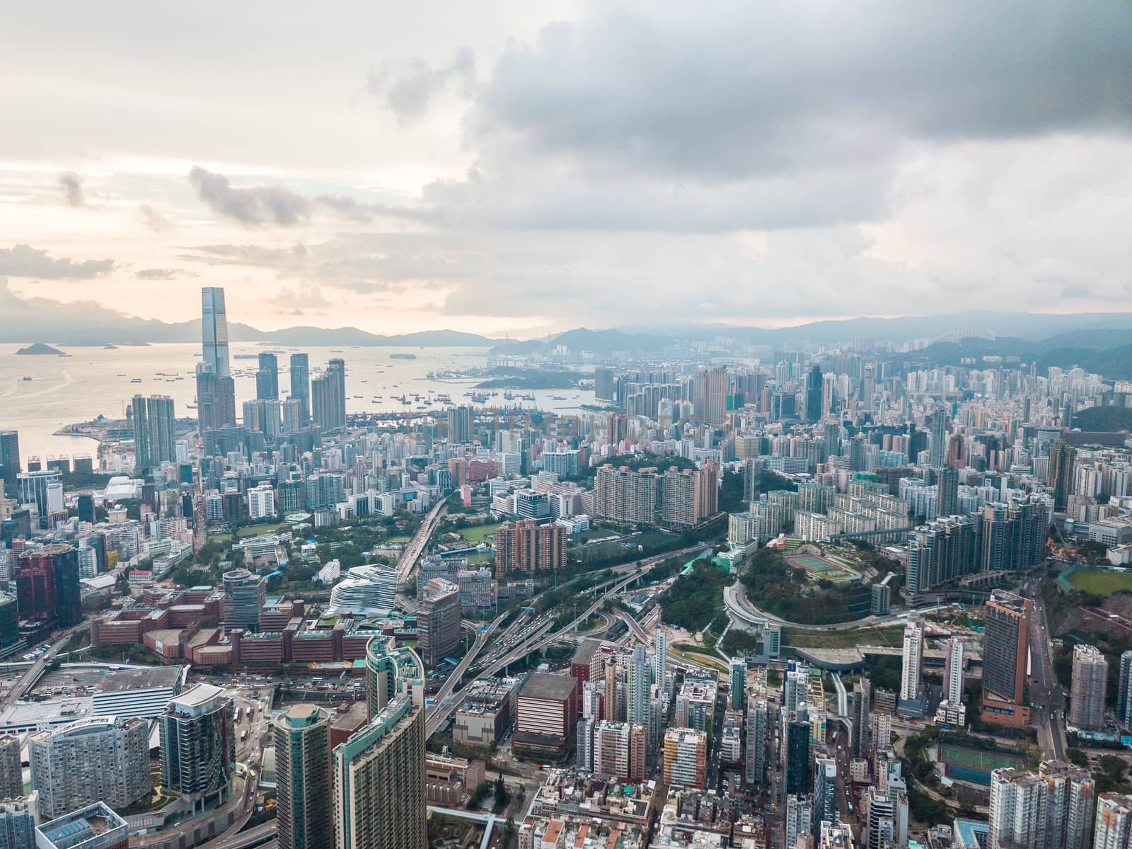 Top view aerial photo from flying drone of a HongKong Global City with development buildings, transportation, energy power infrastructure. Financial and business centers in developed China town