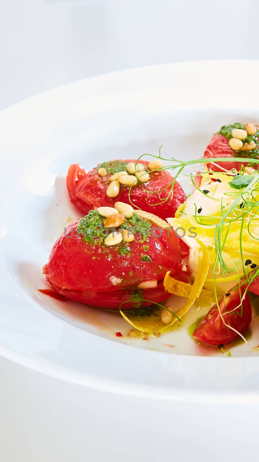 Mozzarella and tomato salad - caprese on the white plate. Shallow dof by sarymsakov