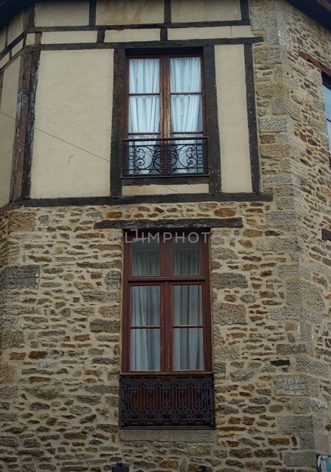 Old traditional French stone building with wooden windows by sheriffkule