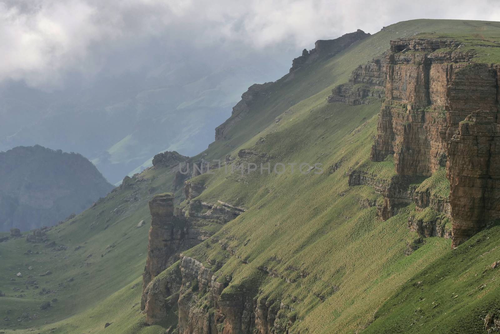 Rocky Mountains cliff and clouds fog. Nature landscape.