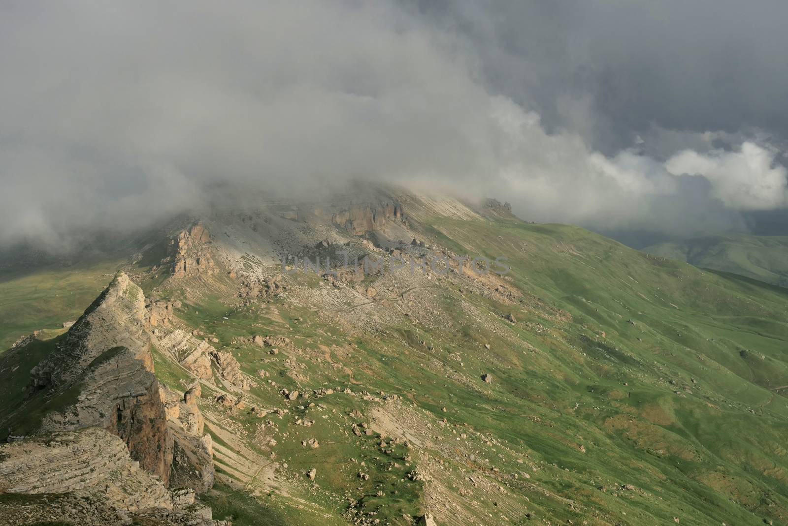 Rocky Mountains cliff and clouds fog. Nature landscape.
