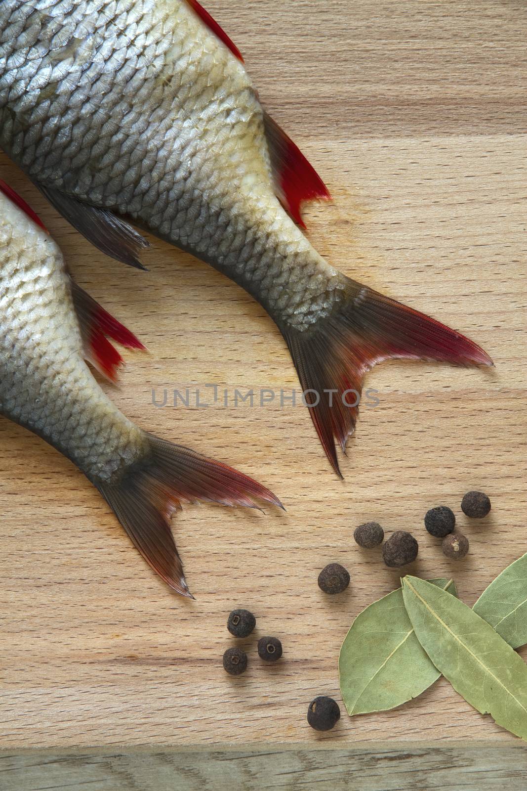 raw fish on a wooden board