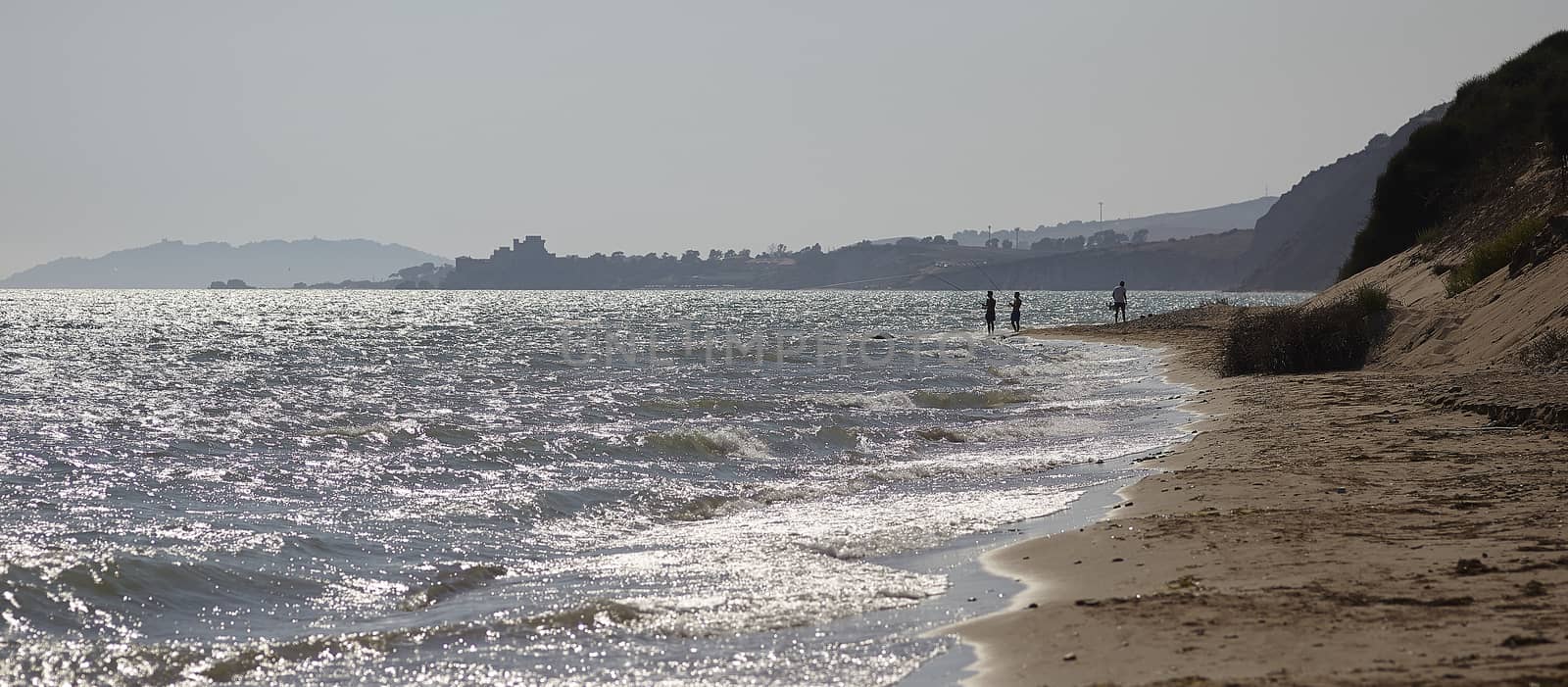 Fishing on the seashore by pippocarlot