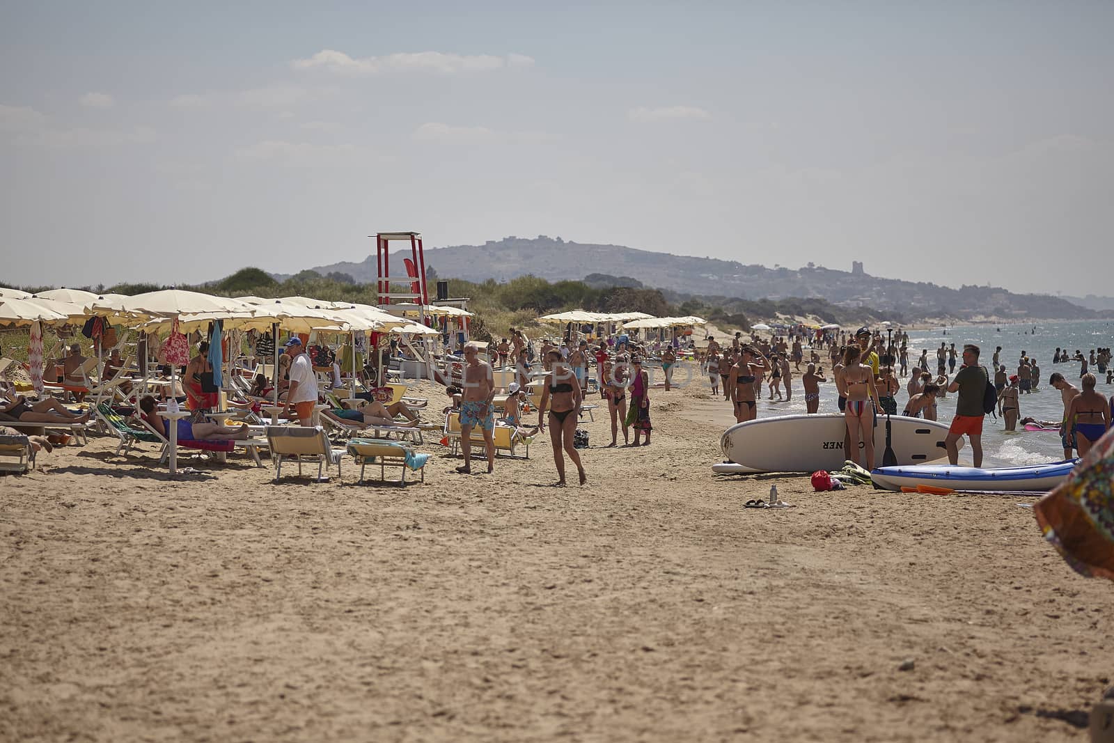 Beach full of tourists in Marina di Butera, Sicily