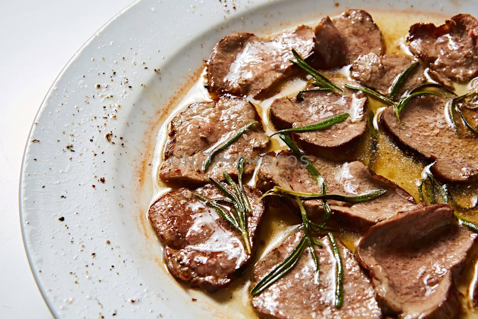 Fried beef tongue with coarse salt. Grilled beef tongue