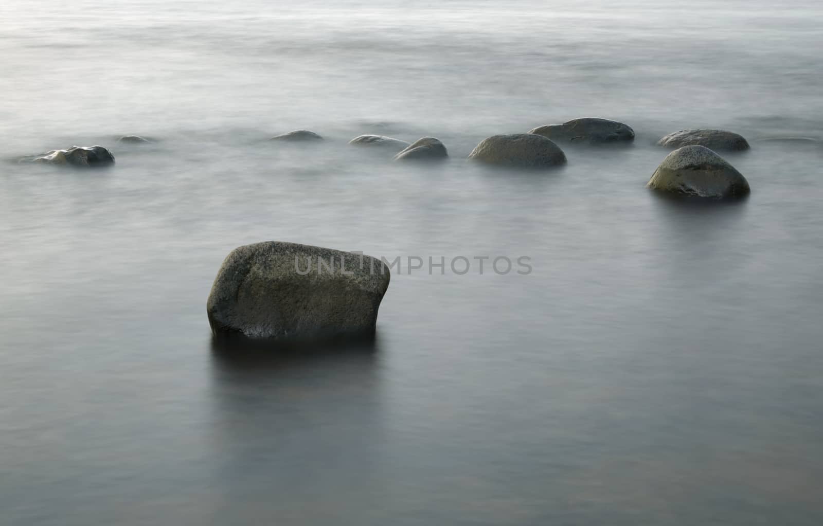 Stones in the Water at Evening Sun, Long time Exposure