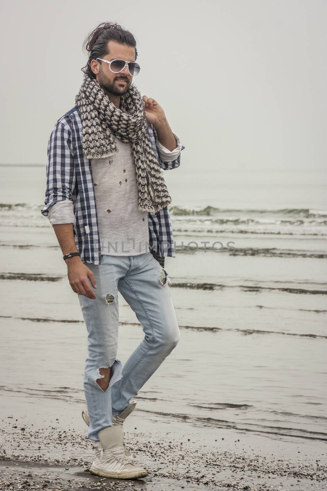 Fashion boy at beach by pippocarlot
