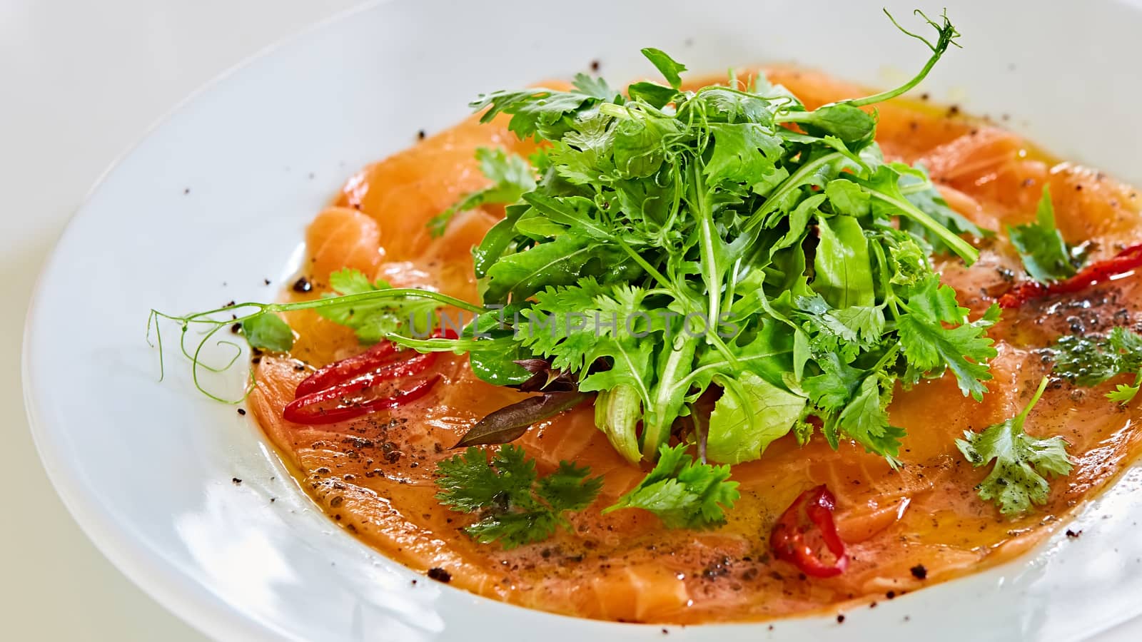 Top view of salmon carpaccio. Shallow dof