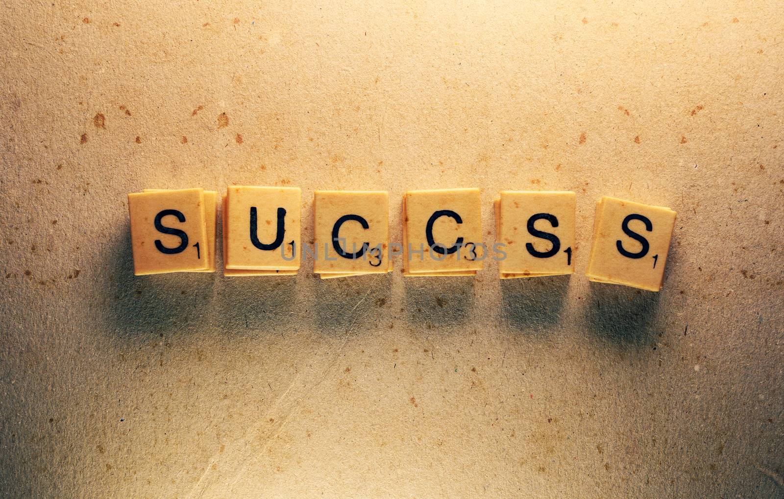 Close up of success tag label composed in scrabble