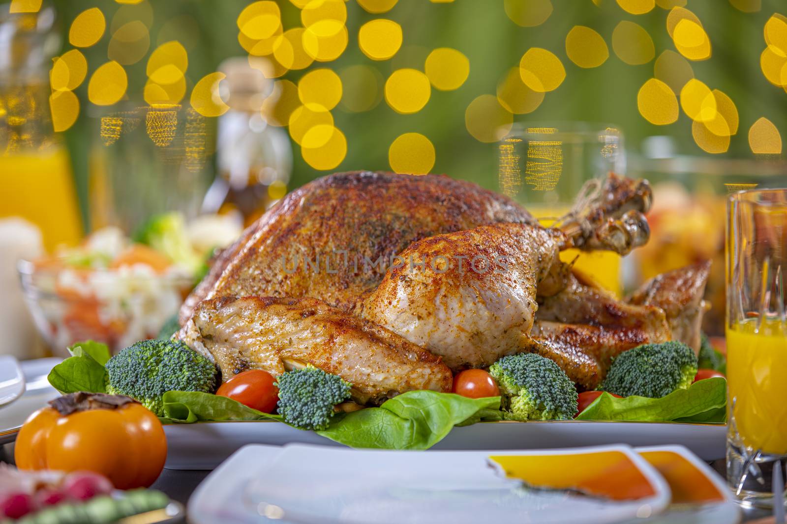 Celebrating Thanksgiving with roasted turkey on festive table. Roasted turkey on festive table for Thanksgiving celebration