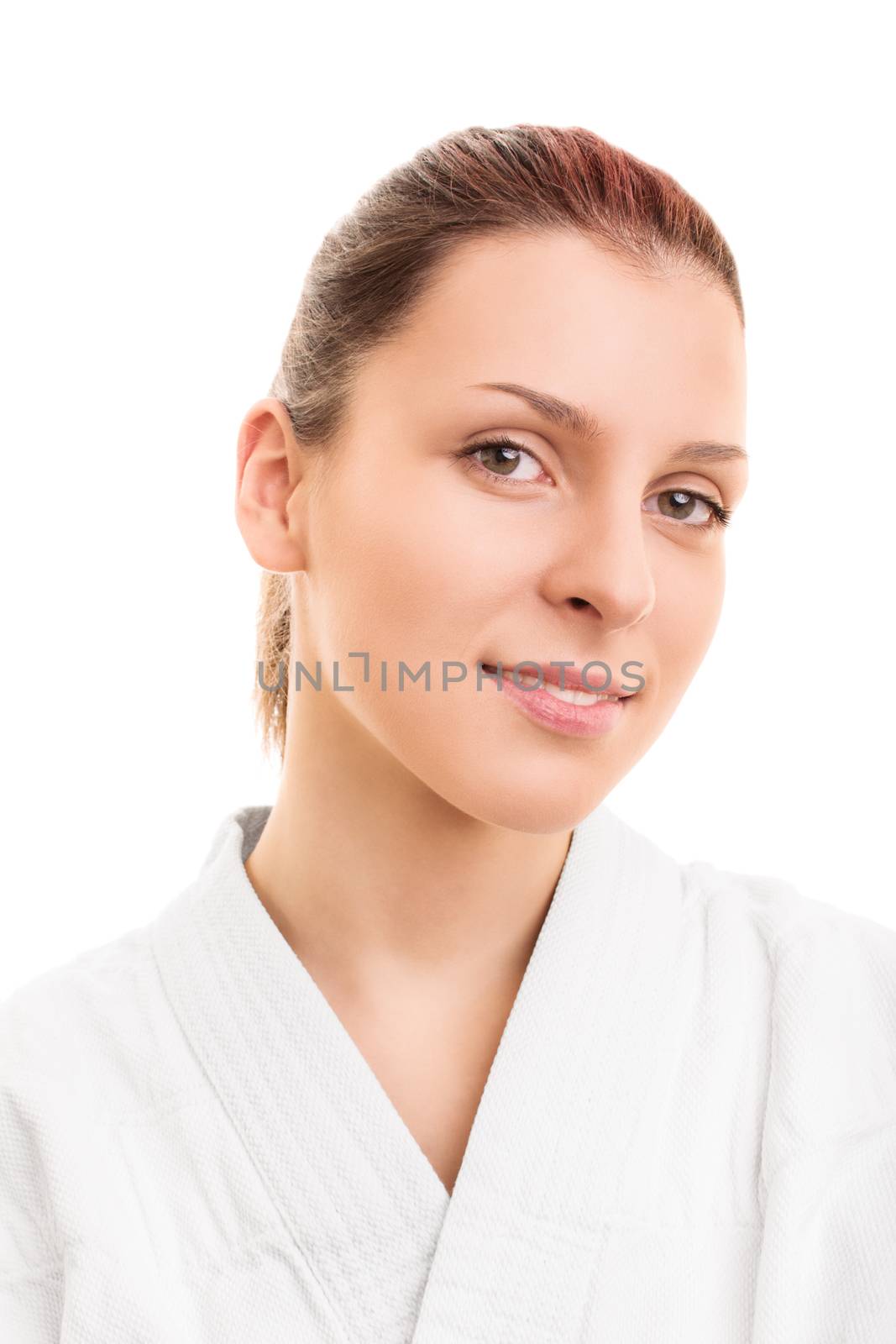 Resolved and dedicated. Close up portrait of a beautiful young girl wearing white kimono, isolated on white background.
