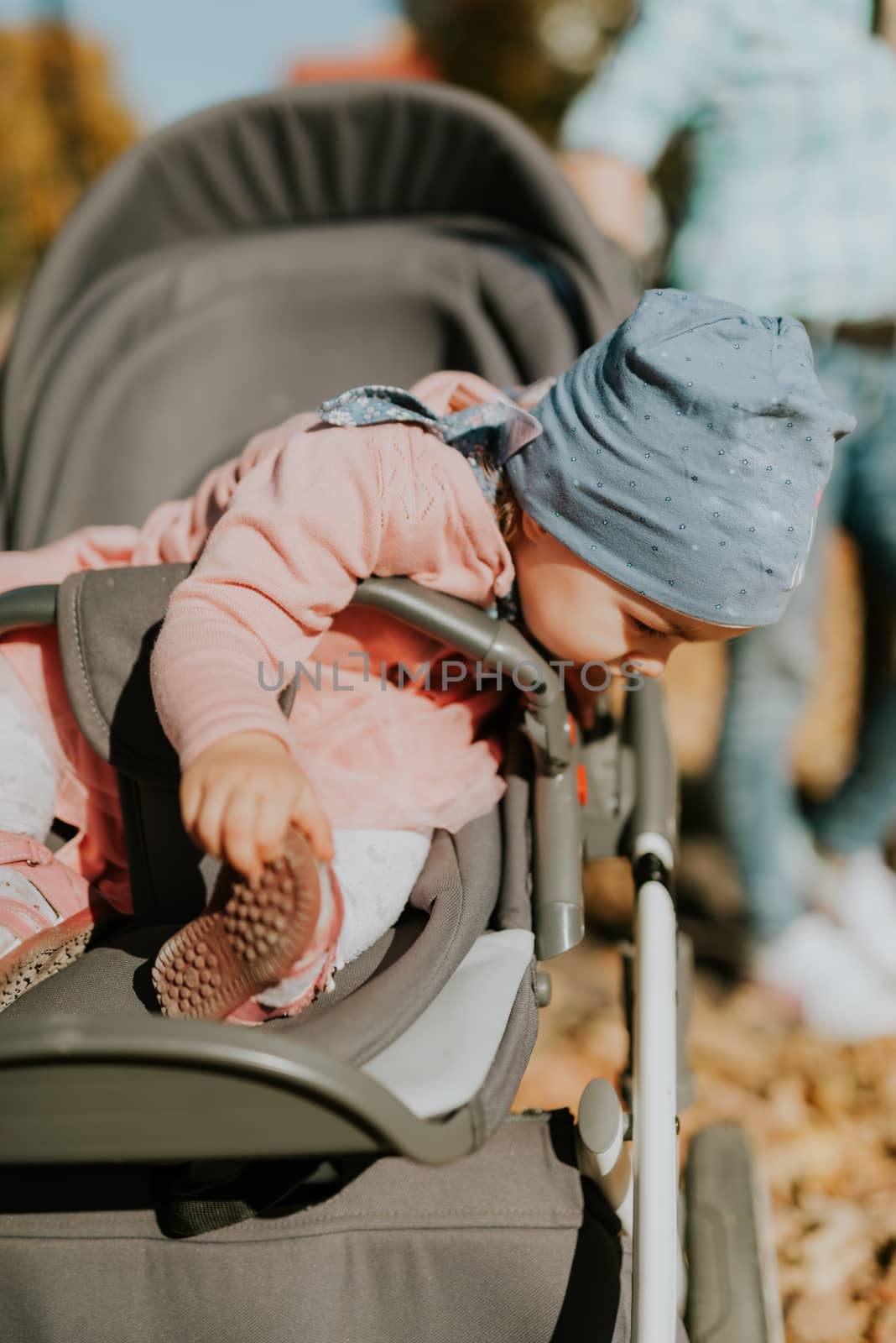 Adorable girl having fun on beautiful autumn day. authentic childhood image