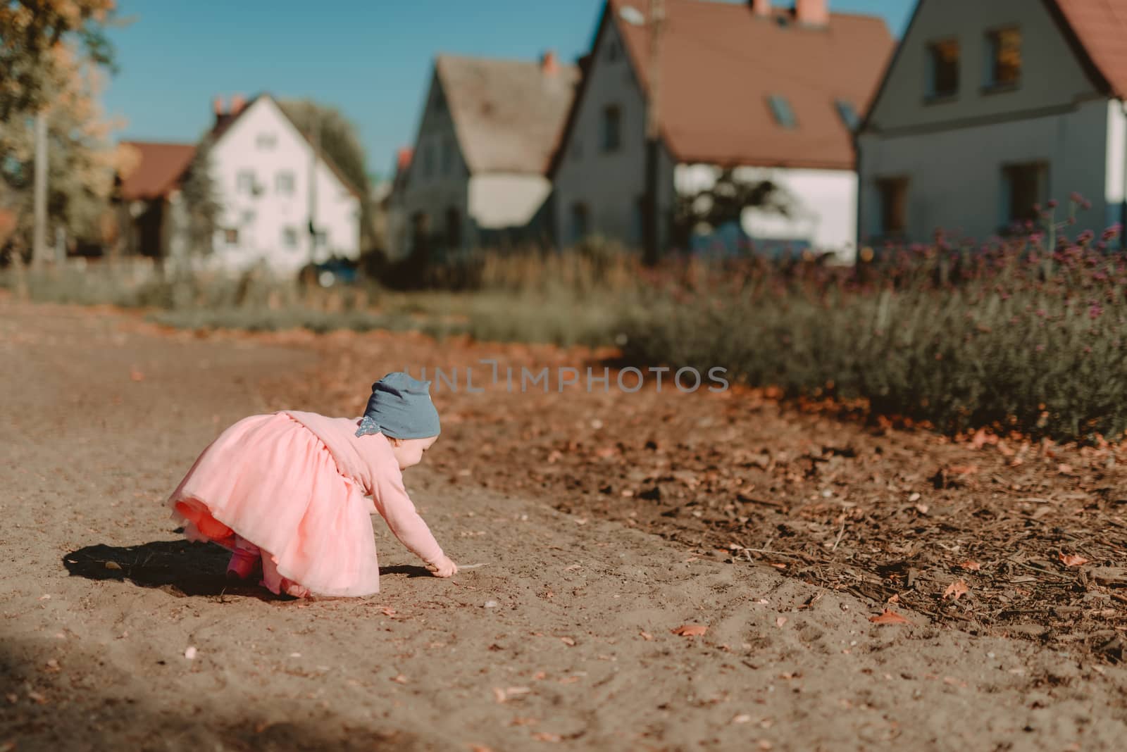 Adorable girl having fun on beautiful autumn day. authentic childhood image