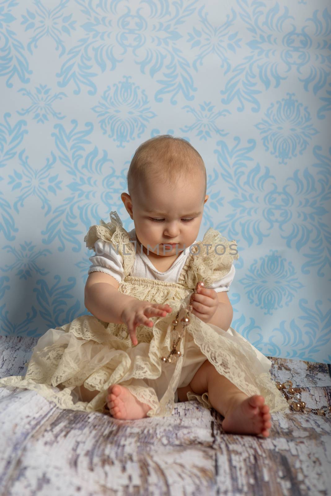 Portrait of adorable baby girl. Childhood. Authentic image