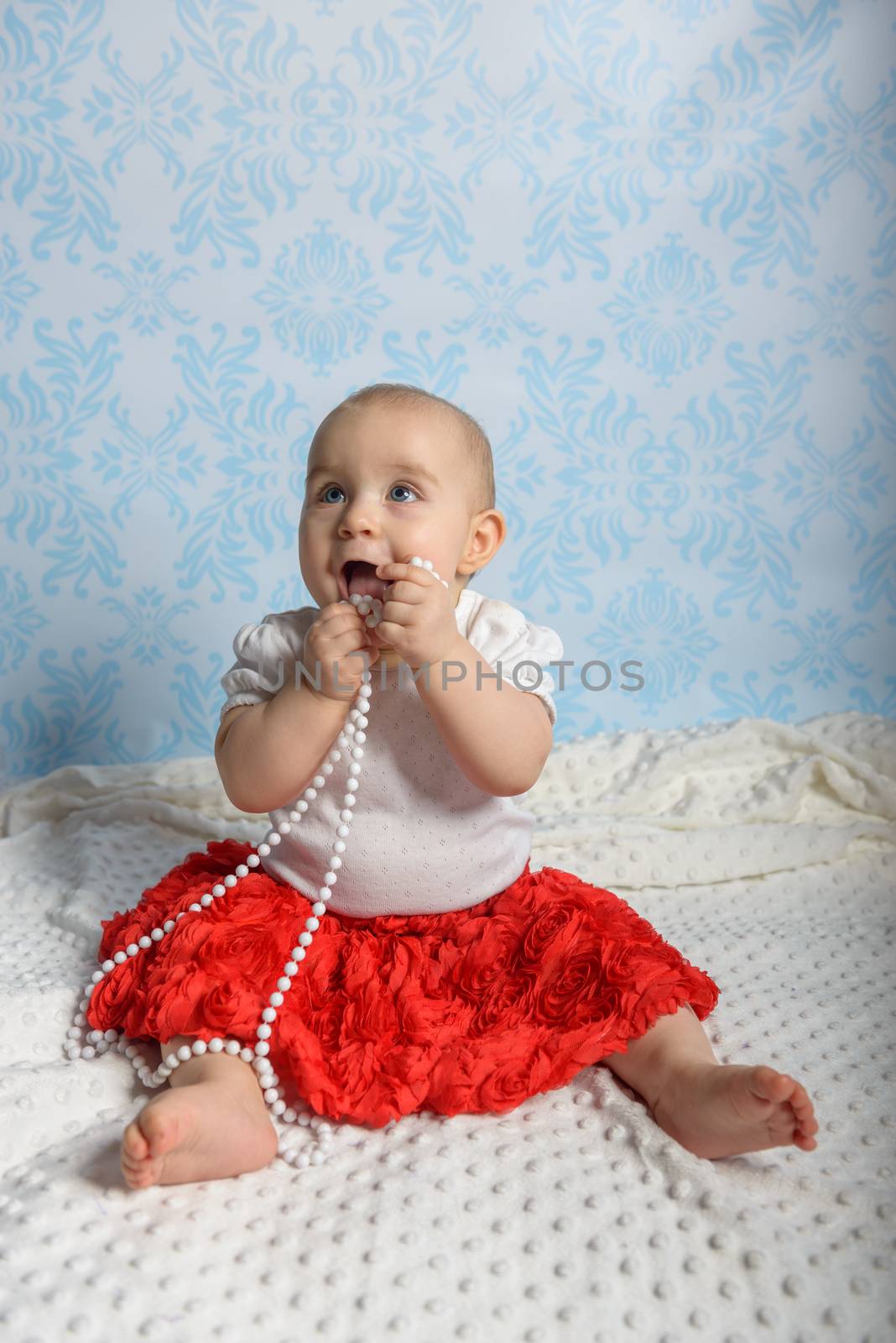 Portrait of adorable baby girl. Childhood. Authentic image