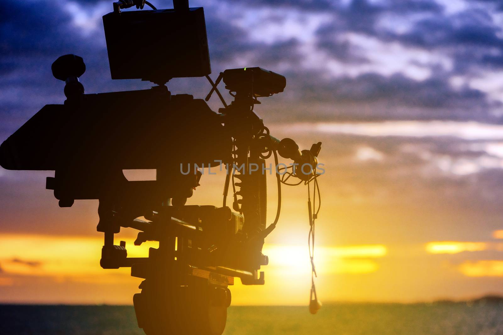 Film industry. Filming with sunset background