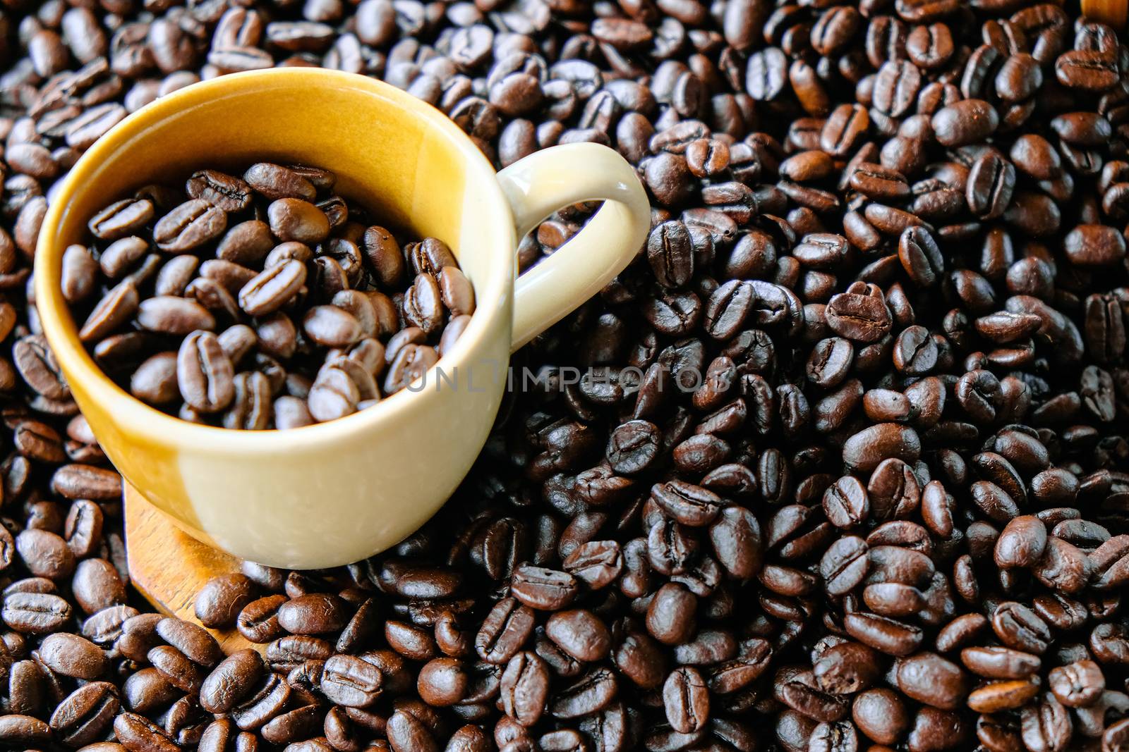 Cup of coffee with coffee beans