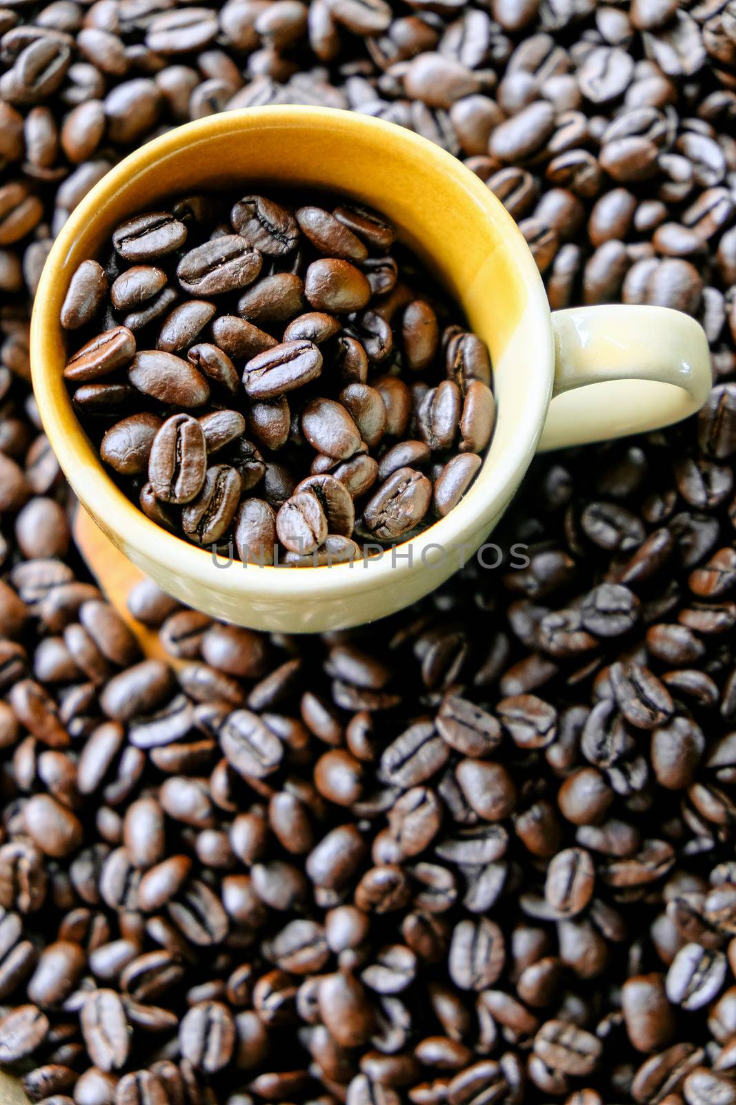 Cup of coffee with coffee beans