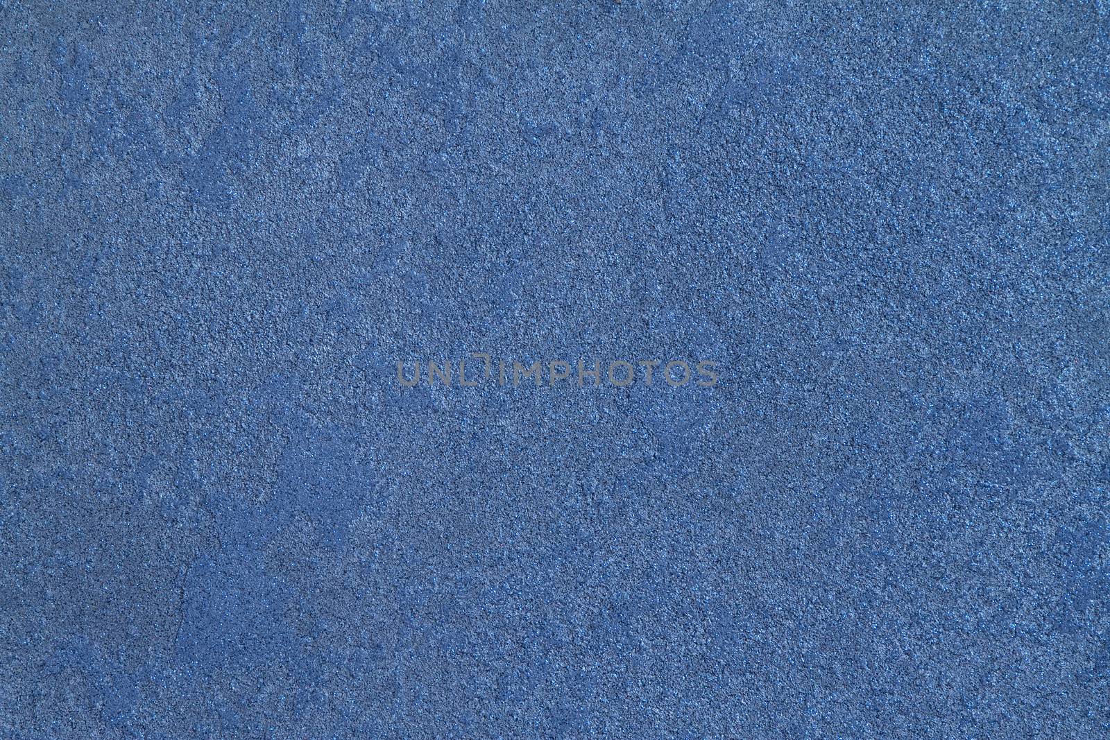 texture  of the painted  stone  wall, blue with sparkles 