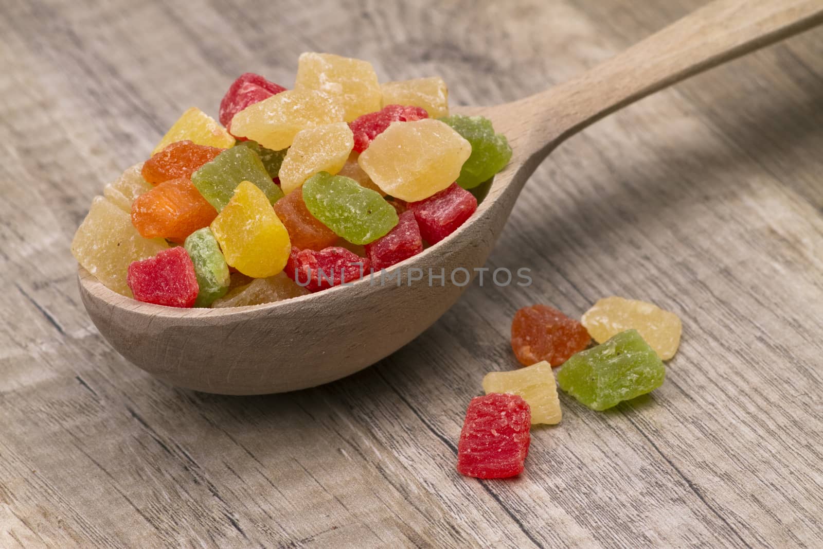  different dried fruits in wooden spoon on table