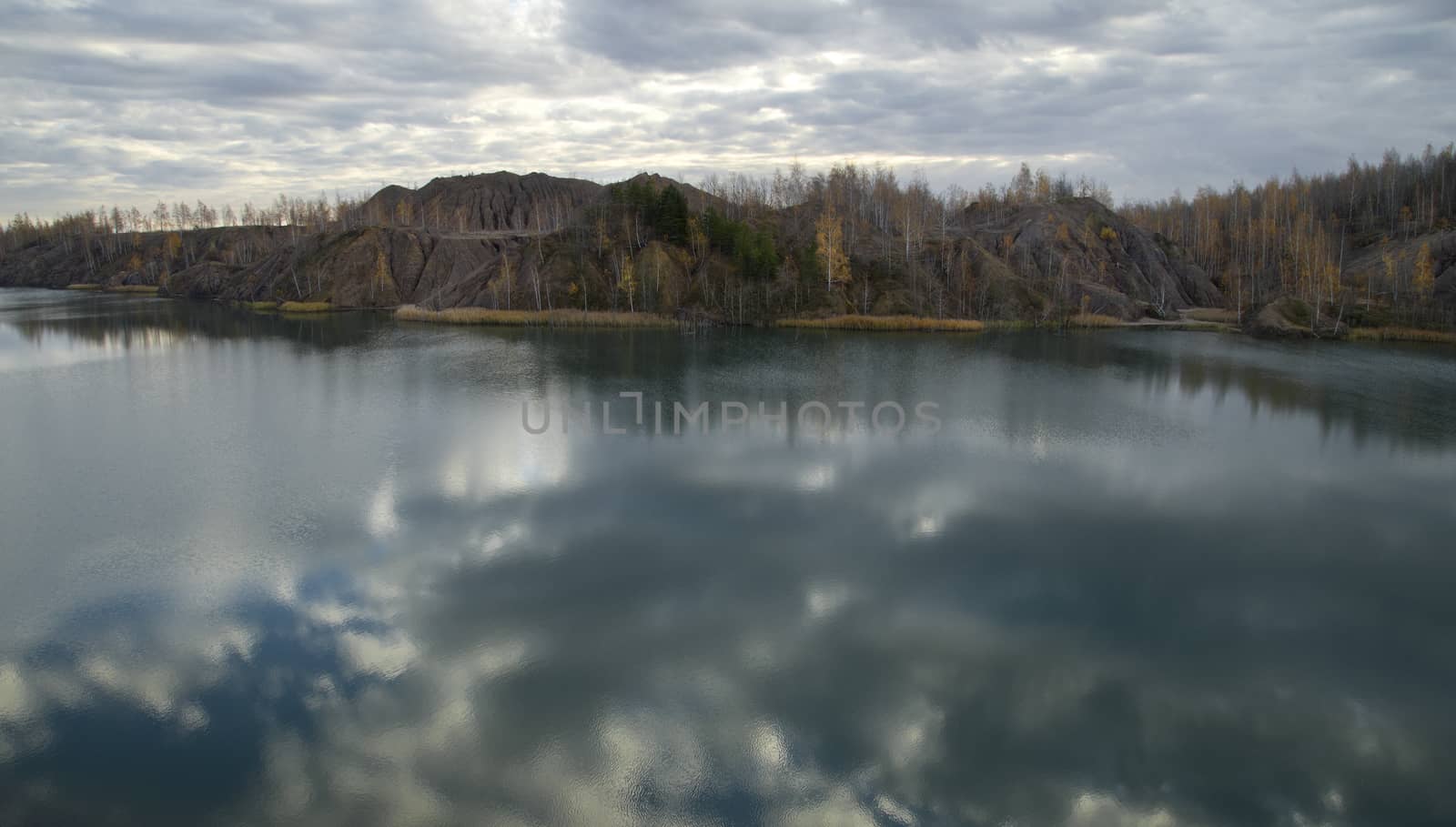 Autumn Forest Around the Lake in an Abandoned Quarry