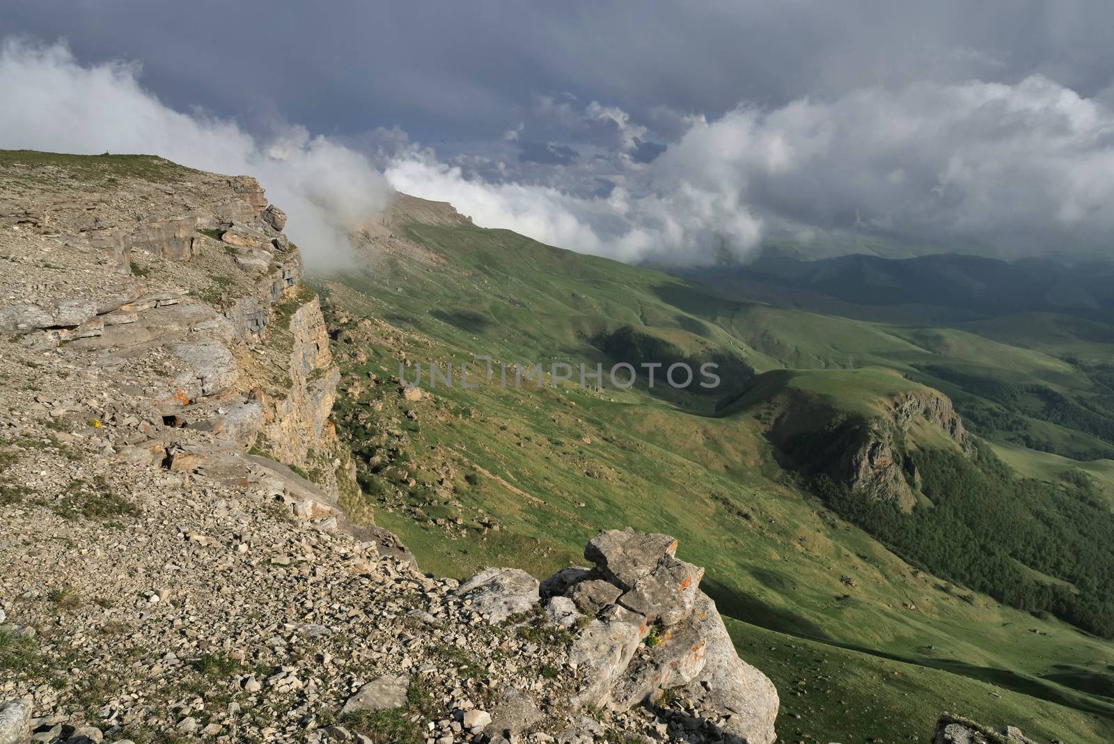 Rocky Mountains cliff and clouds fog. Nature landscape.