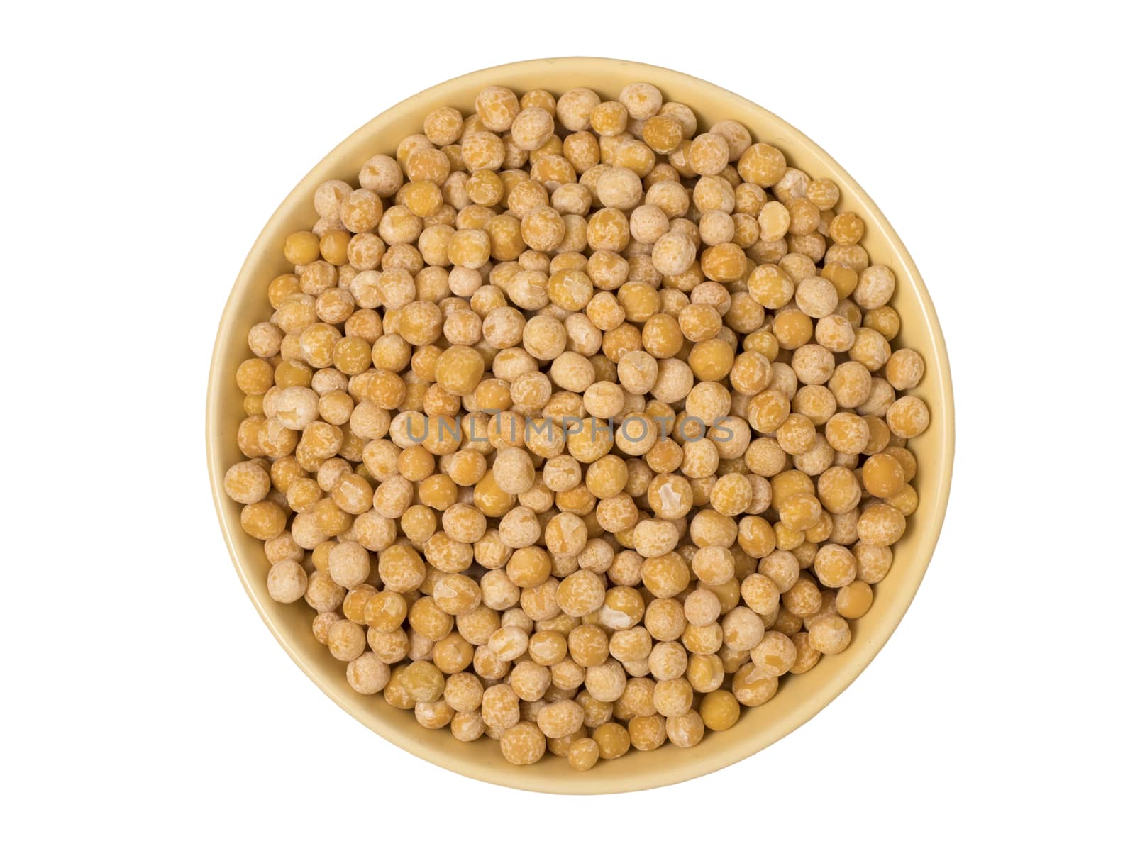 Bowl of yellow dried chickpeas on white background.
