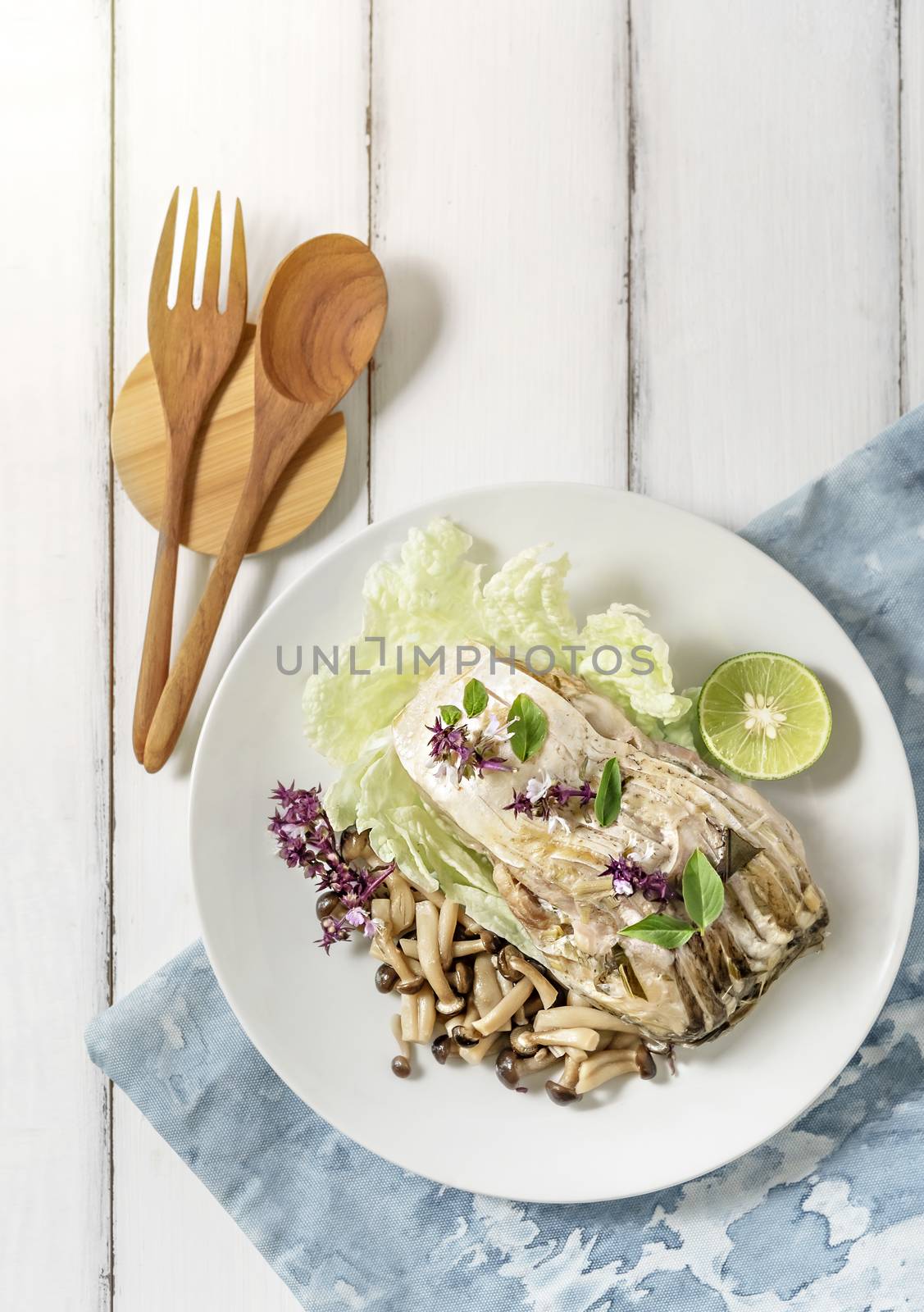 top view of fish dish over wooden background