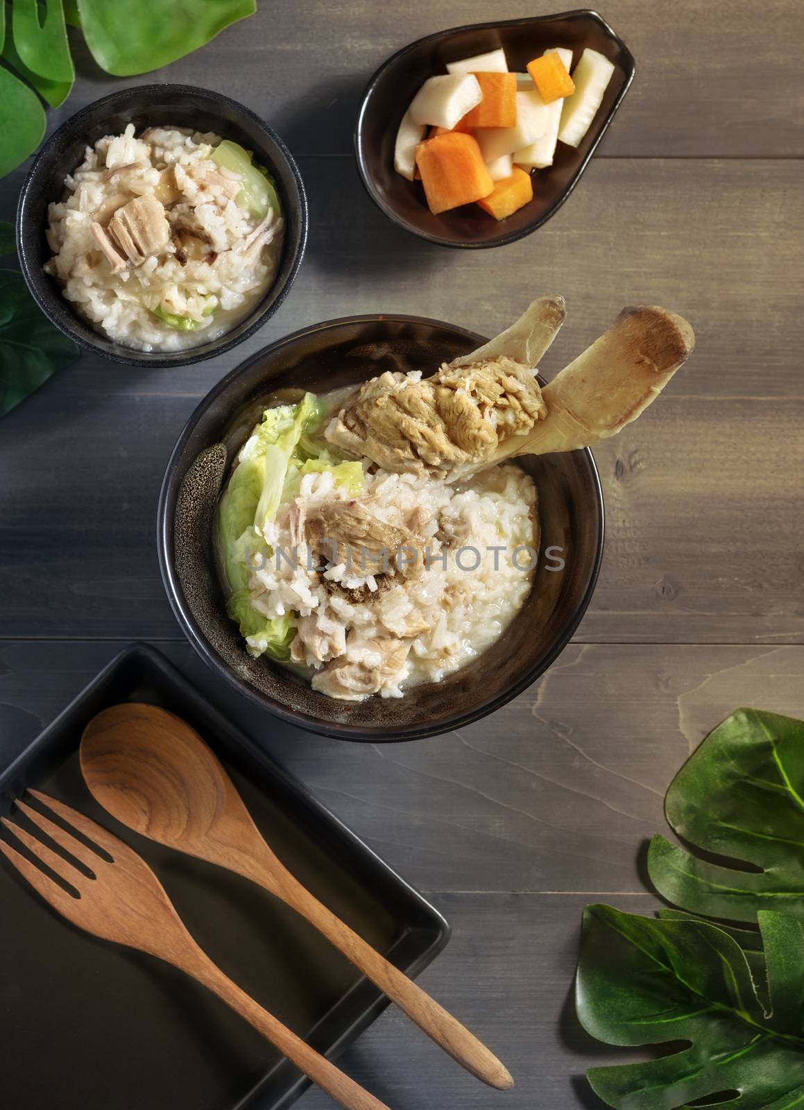 Top view of asian style rice soup with pork in a bowl