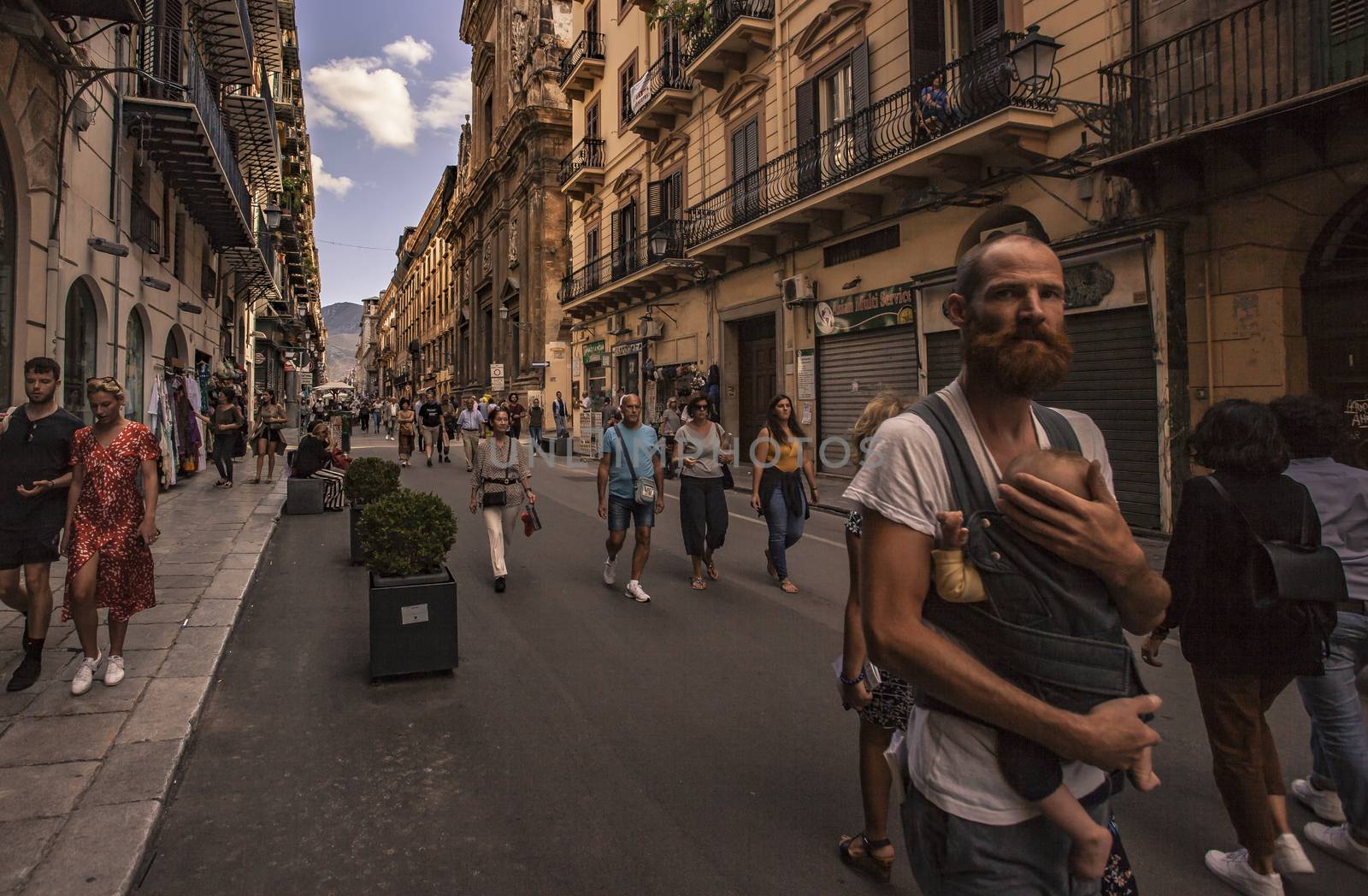 Street life in Via Maqueda in Palermo full of people walking around