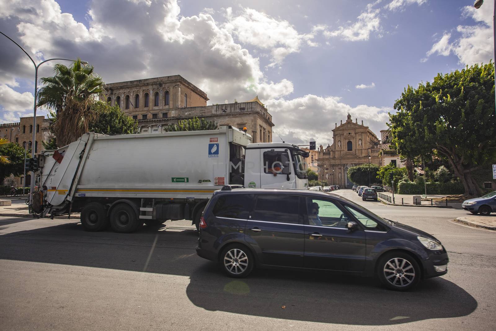 Garbage truck on street by pippocarlot