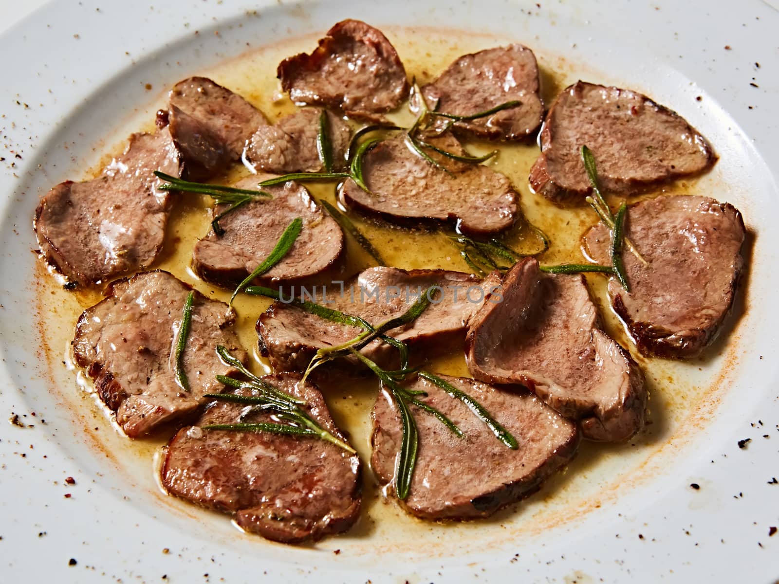 Fried beef tongue with coarse salt. Grilled beef tongue