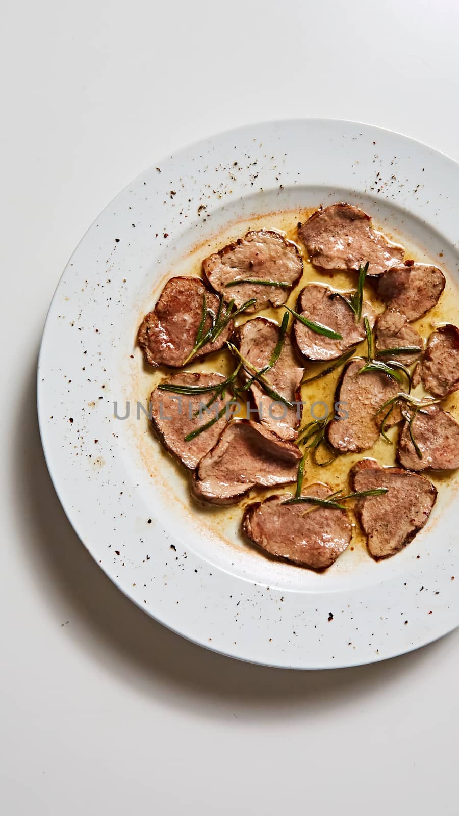 Fried beef tongue with coarse salt. Grilled beef tongue