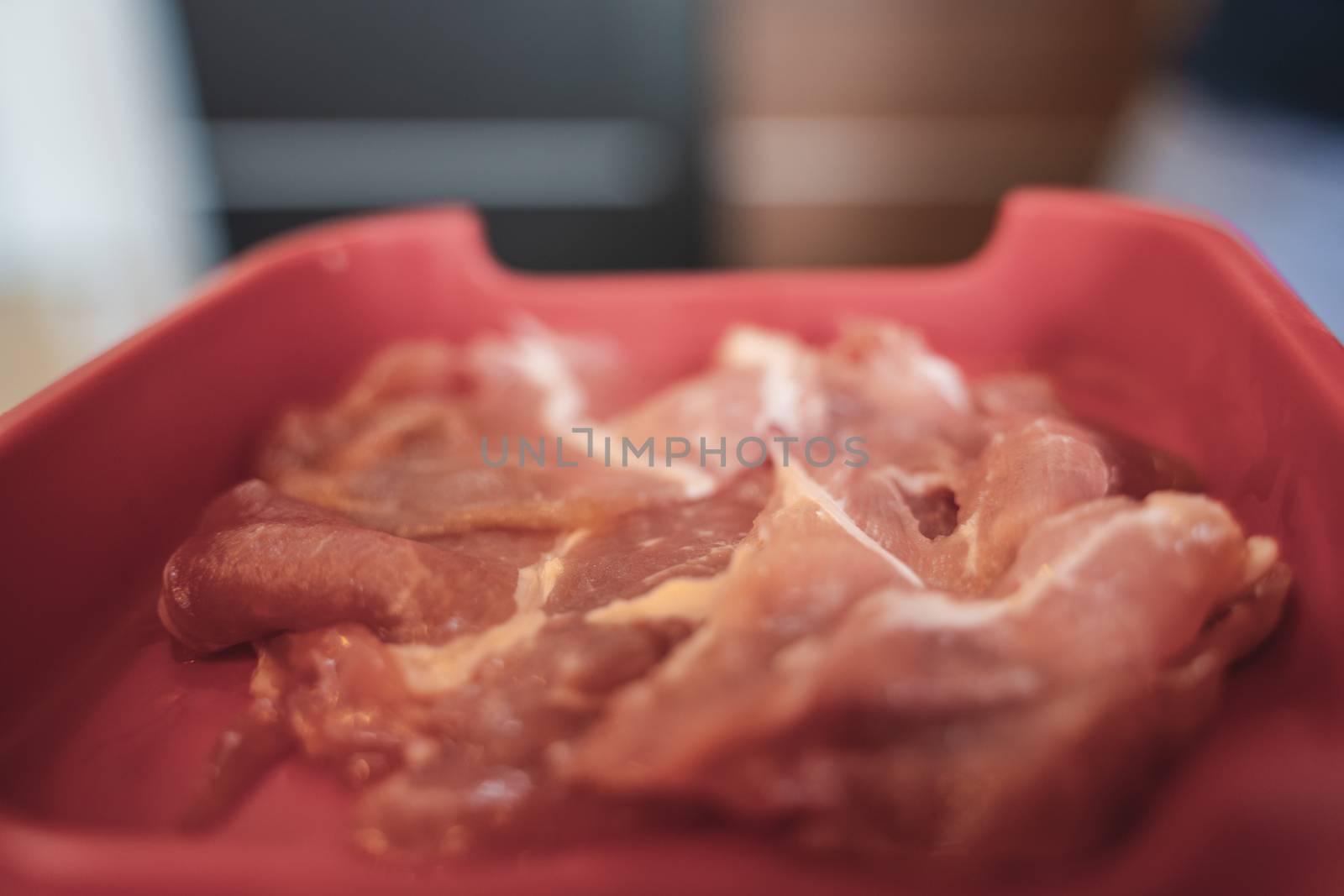 The sliced raw pork meat isolated on white background. Top view.