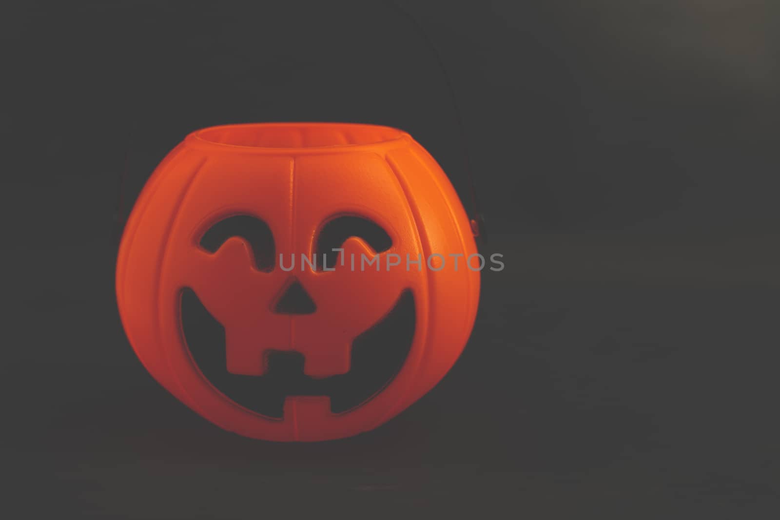 The Halloween pumpkin on dark background with space for text