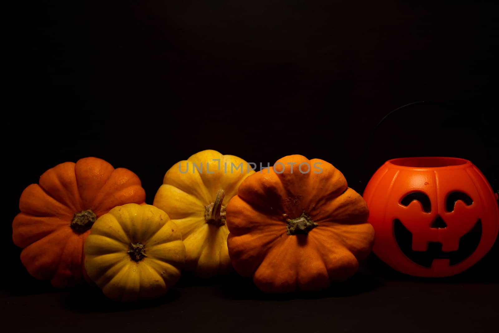 Halloween pumpkin on dark background with space for text by peerapixs