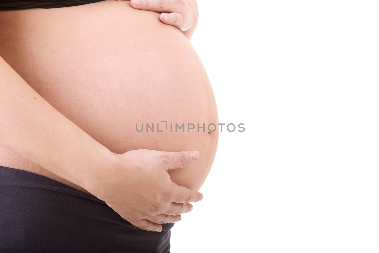 Closeup of pregnant woman at white background