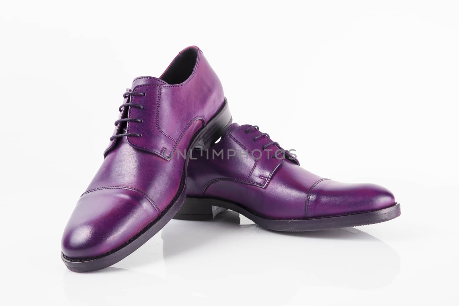 Male purple leather shoes on white background, isolated product.