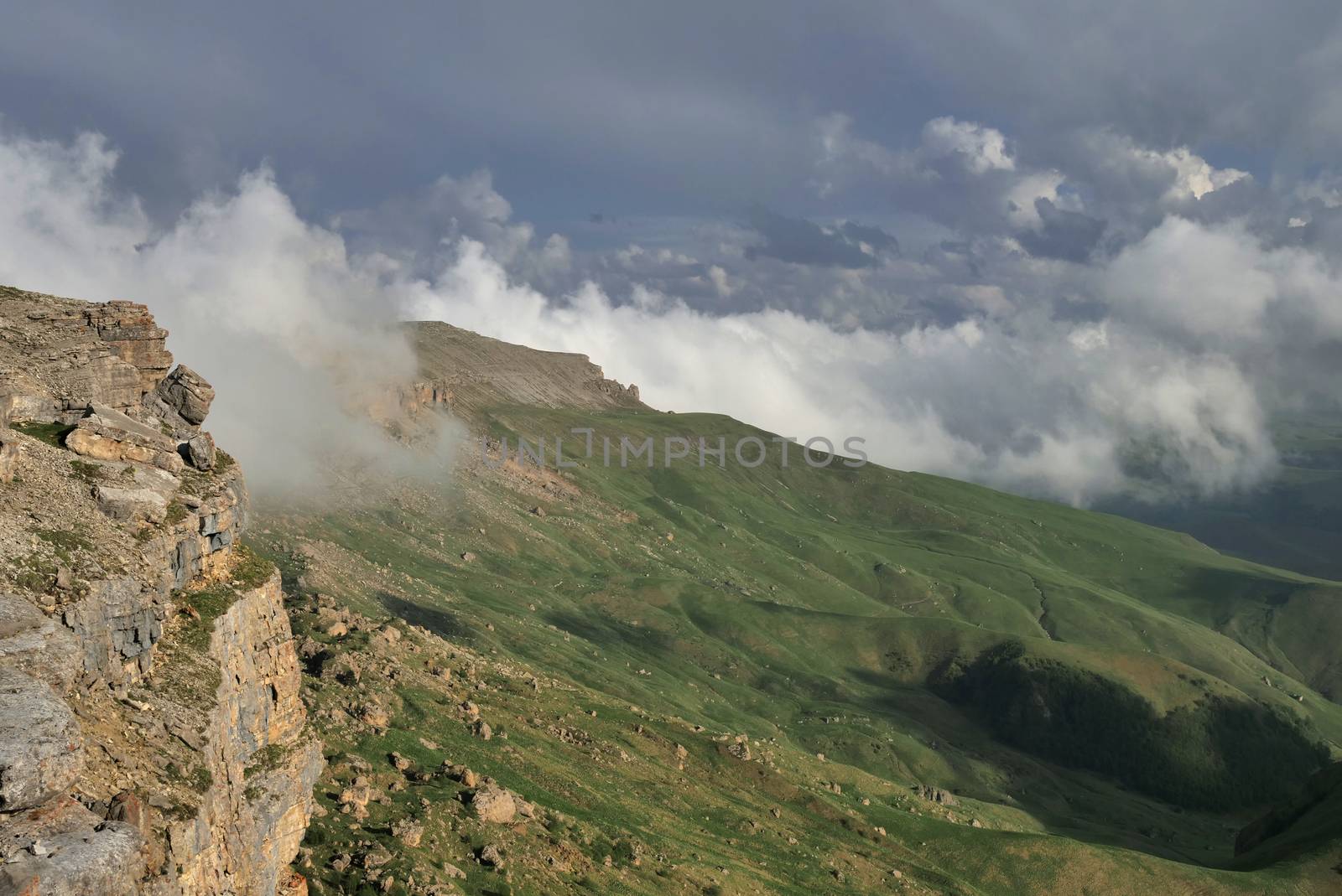 Rocky Mountains cliff and clouds fog. Nature landscape.