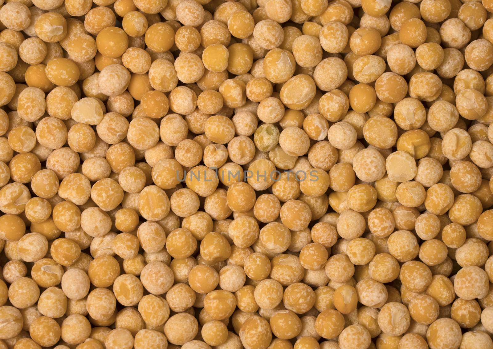 Yellow dry peas as background, close up view.