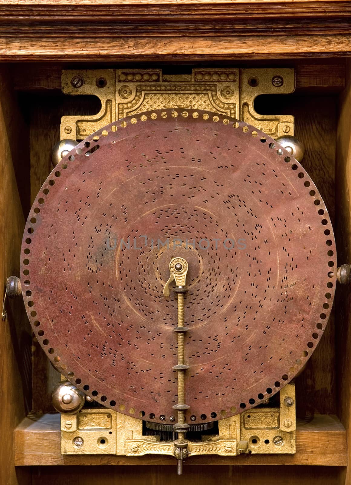  an ancient musical box, front image of disk with holes
