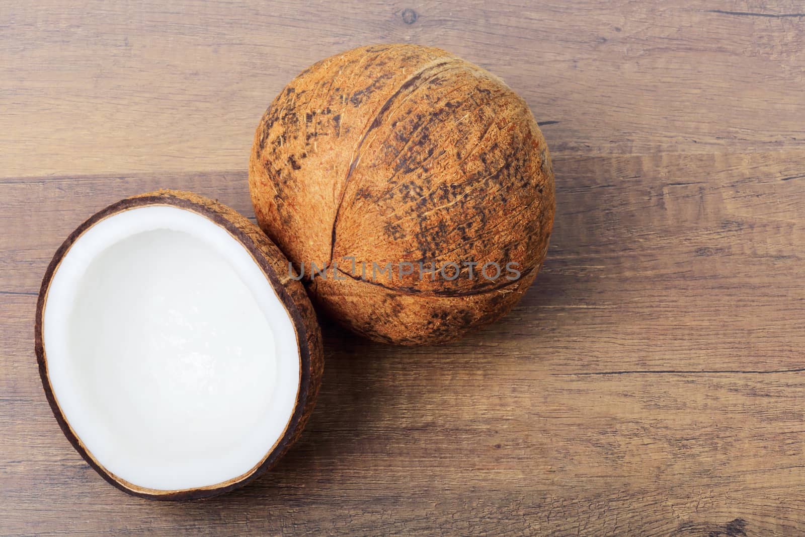 Group of fresh coconuts on wood background. 