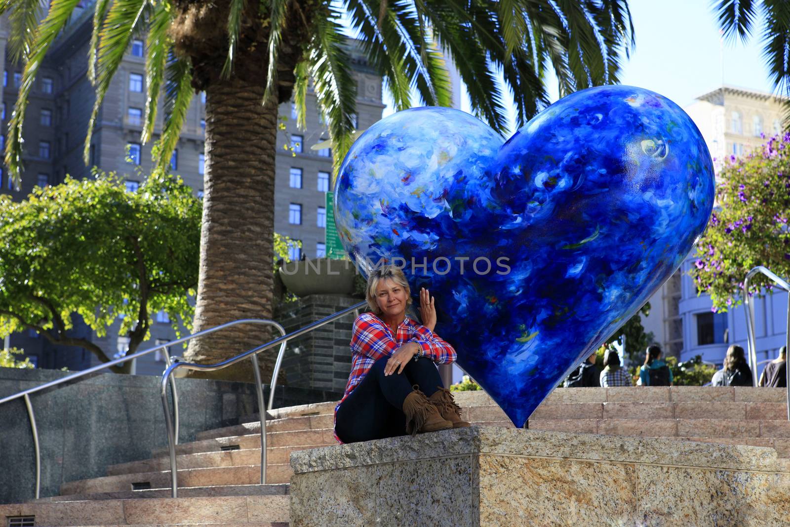 Tourist on Union Square Park in San Francisco with Hart on Display