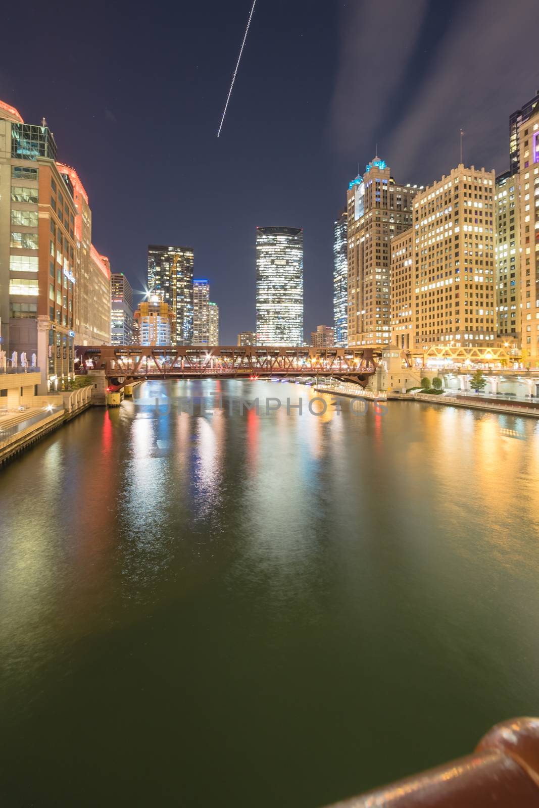 Picturesque riverside Chicago skylines at blue hour along Wells Street by trongnguyen