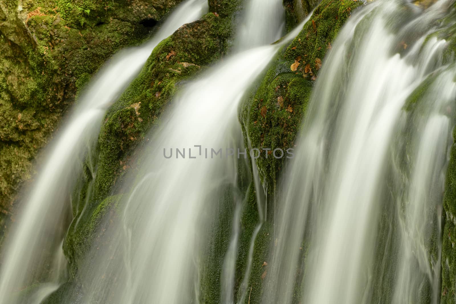 Beautiful Maly waterfall in super green spring forest surroundings, Czech Republic