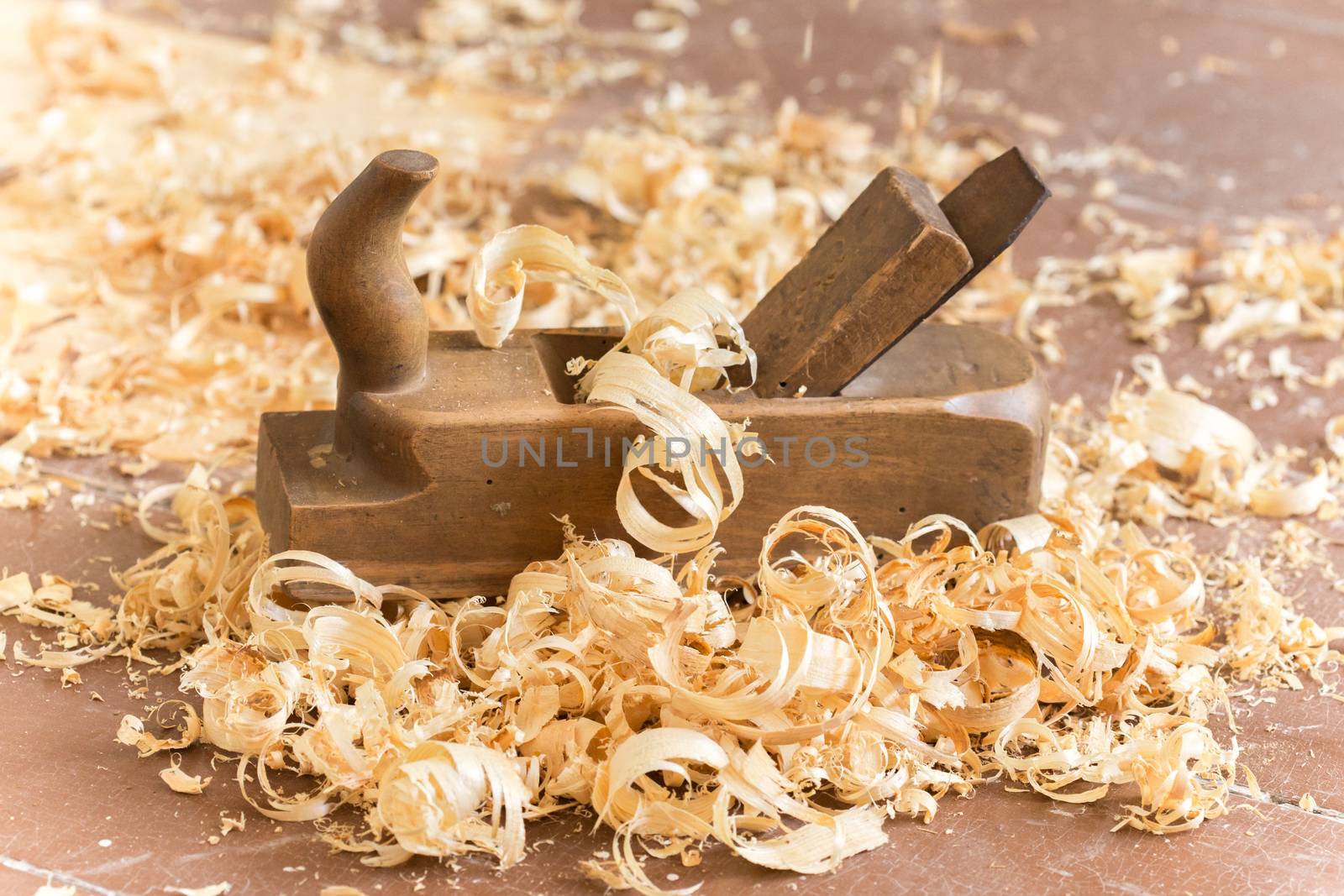 Old wooden hand plane for woodworking.